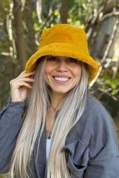 Classic fur bucket hat. Features a flat top & finished with an all-around brim. 100% Polyester. Fur Bucket, Fur Bucket Hat, Flats Top, Denim Jumpsuit, Cardigan Tops, Bottom Clothes, Skirt Pants, Hair Jewelry, Bottoms Pants