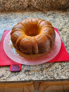 a bundt cake sitting on top of a pink plate