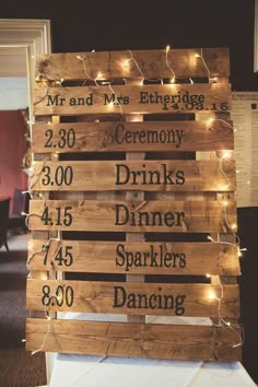 a wooden sign that has lights on it