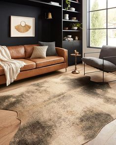 a living room filled with furniture and a brown rug