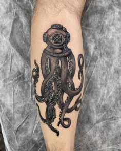 an octopus with a diving mask on its head is depicted in this tattoo art piece