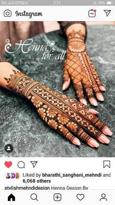 an image of someones hand with henna on it