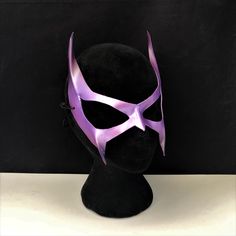 DESCRIPTIONGo retro! A lightweight purple leather mask for your '90s Catwoman Cosplay costume. Great Halloween Mask. Waterproofed leather, glossy or matte finish, & several choices to affix the mask (cord, elastic, ribbon, waterproof cord, stick, or no holes for adhesive). Measurements: 13" high x 11" wide (tallest & widest points); 0.5" high between the eyes; 2.5" wide x 2" tall eye openings ---------------------------------------------------------------------------- ALL OF OUR MASKS AR Catwoman Mask, Cosplay Masks, Catwoman Cosplay, Superhero Masks, Elastic Ribbon, Leather Mask, Cat Woman Costume, Hero Costumes, Halloween Mask