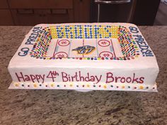 a birthday cake that is on top of a counter