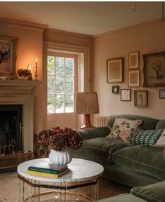 a living room filled with furniture and a fire place