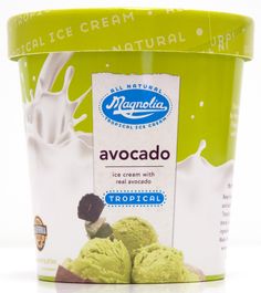 an ice cream container filled with green and chocolate flavored desserts on top of a white surface