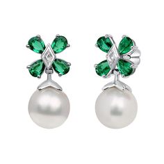 Earrings with a pearl hanging from a flower formed by pear-shaped emeralds and lozenge-shaped diamond center