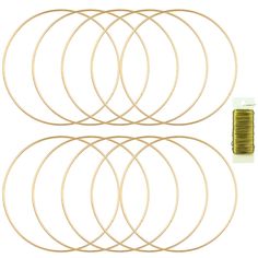 set of six gold colored metal rings with thread spools