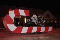 a large letter decorated with lights and candy canes