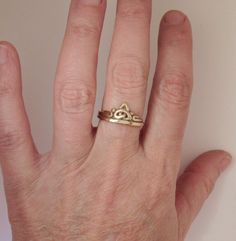 14k Yellow Gold Celtic Knot Ring, Handmade One of a Kind Artisan Ring Made in the USA with Free Shipping, Size 8 1/4 R1294- 14k Yellow Gold Celtic Knot Ring. The top of the ring measures 10mm Wide and the band is 2 mm wide. It is a SIZE 8 1/4 and can be sized down for Free. Small fee for sizing up, please contact me with your exact size and I will let you know the cost. Nice low profile everyday ring, put it on and forget it. It is Handmade and One of a Kind, Flat sided so It could go up against Untreated Recycled Gold Jewelry As A Gift, Untreated Recycled Gold Jewelry Gift, Recycled Gold Untreated Jewelry As A Gift, Handmade Yellow Gold Stackable Wedding Rings, Handmade 14k Gold Stackable Rings For Wedding, Handmade 14k Gold Stackable Rings For Anniversary, Adjustable Gold Jewelry, Handmade Stackable 14k Gold Rings For Anniversary, Unique 14k Stamped Jewelry For Wedding