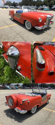 an old red car parked in a parking lot