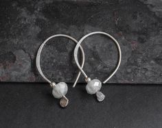 Silver hoop earrings Tiny dangle earrings Silver dangle earrings Glass silver earrings Hoop silver earrings Dangle drop earrings handmade Material: Silver, glass Please check dimensions carefully because items may appear larger or smaller on the photos. Please, avoid dropping jewelry! Please, keep the jewelry away from perfume and other alcohol containing fluids because the alcohol damages the material. Store the fragile items in separate boxes and treat them with care. Misuse may result in dama Silver Small Hoop Teardrop Earrings With Ear Wire, Earrings Hoop Silver, Hoop Silver Earrings, Dangle Earrings Silver, Silver Glass, Earrings Hoop, Silver Dangle Earrings, Silver Earrings Dangle, Earrings Dangle