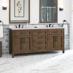 a bathroom with double sinks and two mirrors on the wall next to a brick wall