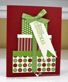 a christmas card with green and red wrapping paper on it, tied up in a bow