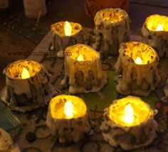 many lit candles are placed in the shape of elephants