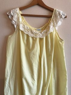 Adorable nightdress by Carol Brent.  Yellow cotton fabric with a beautiful lace trim neckline. Sleeveless and just slips on. Fits loose and comfy. No rips or stains. No size tag but will fit a size Medium - Large. See below and pictures. Measurements laying flat approximately: Armpit to armpit 21" Waist 48" Shoulder to hem 36" Wear this beauty at night or just to lounge around the house! FREE SHIPPING ON THIS ITEM. Thank you for shopping! Remember that vintage items are pre-owned, aged and lovingly cared for but probably have a blemish or imperfection. Request additional photos if questionable before purchasing. Photo and descriptions are done as best as possible to depict items. Lace Nightgown, Lingerie Dress, Yellow Lace, Women's Nightgowns, Pajama Robe, Night Dress, Night Gown, Lace Trim, Lingerie