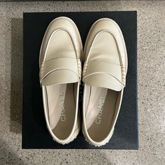 New With Tags And Box Designer Beige Slip-on Loafers, Chic Beige Leather Shoes With Rubber Sole, Classic Beige Leather Shoes With Flat Heel, Classic Beige Flat Heel Leather Shoes, Cream Round Toe Flats For Formal Occasions, Luxury Beige Flats For Formal Occasions, Cream Leather Flats For Formal Occasions, Elegant Beige Slip-on Leather Shoes, Formal Cream Leather Flats