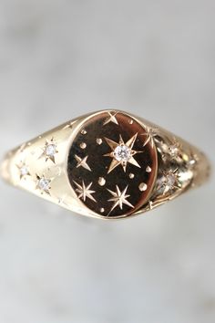 celestial engraved diamond signet ring $2,350 Redesigned Heirloom Jewelry, Unique Signet Ring, Star Signet Ring, Signet Engagement Ring, Signet Engagement Rings, Orion Star, Star Wedding Band, Jewelry Engraving, Engraving Jewelry