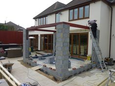 a house being built with concrete and brick