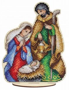 a cross stitch nativity scene with jesus and mary