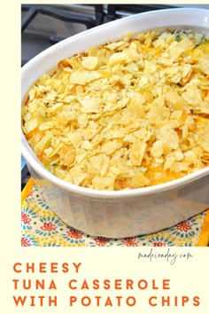 a casserole dish with potato chips in it and the words cheesy tuna casserole with potato chips