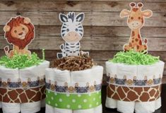 three diapers with animals and giraffes sitting on top of each other