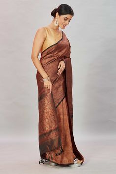 Look your ethnic best at weddings and special occasions in this brown Tanchoi Banarasi silk saree. It comes with a matching blouse piece. Disclaimer: The shown stitched blouse on the model is for display purpose only. The saree comes with a matching blouse piece and finished with fall and piko. Formal Pre-draped Saree In Raw Silk With Zari Weaving, Festive Brown Pre-draped Saree For Wedding, Formal Handloom Silk Pre-draped Saree, Elegant Brocade Pre-draped Saree For Puja, Elegant Pre-draped Brocade Saree With Zari Weaving, Brown Anarkali Dupatta For Festive Occasions, Elegant Brown Dupatta Traditional Drape, Festive Anarkali Brown Dupatta, Festive Brown Anarkali Dupatta