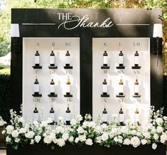 a display with bottles and flowers on it