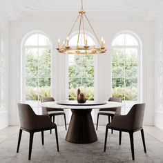 a dining room table with four chairs and a chandelier hanging from the ceiling