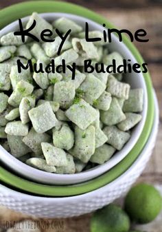 key lime muddy buddies in a green and white bowl on a wooden table with limes