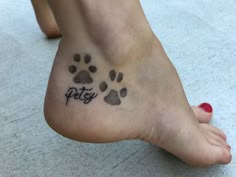 a person has a paw print on their foot with the word pet written in it