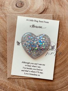 a little hug sent from heaven card with a heart shaped glittery brooch on it