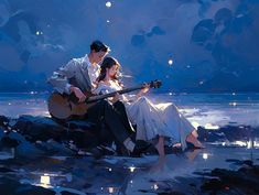 a man and woman are sitting on rocks playing the guitar at night by the water