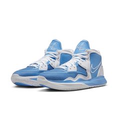 a pair of blue and white sneakers on a white background with the word nike written on it