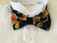 "Stunning and classic bow tie has been design in exotic, bright prints. The Unisex bow ties are an excellent evening addition to any wardrobe. You will look unique at any special occasion. Our bow ties are made in fine satin with interfacing to give it, stability and shape. Approximate Measurements: Bow: 5\" x 2.5\" Adjustable Strap: 14\" x 19\" Bow Tie care :Dry Clean only. We Love Custom Packages Orders All items are sent Via USPS First Class Mail . U.S. shipping times 5-7 Business days." Fitted Red Bow Tie For Black Tie Events, Fitted Gold Bow Tie And Suit Accessories, Fitted Red Bow Tie, Fitted Gold Bow Tie For Wedding, Fitted Tuxedo With Bow Tie Back For Formal Occasions, Formal Fitted Tuxedo With Bow Tie Back, Red Wedding Suit And Tie Accessories, Tuxedo Style Party Ties, Party Tuxedo Ties