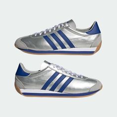 adidas ORIGINALS COUNTRY OG IE4230 UNISEX SHOES Matte Silver/Bright Blue Description Tie your shoelaces and relive the running styles of the 70s. While they're no longer the shoes for running on pavement, all the details you loved back then are still there, including soft cushioning, grippy outsoles, and a low-profile construction. The three stripes on the luxe leather upper give off a vintage vibe. This product is a manifestation of one of adidas' efforts to achieve zero plastic waste, including the use of more than 50% recycled materials in the upper. All my products are 100% Authentic.Please feel free to contact us if you have any question. Shipping We ship using FedEx, DHL and Japan Post. International Buyers - Please Note Import duties, taxes and charges are not included in the item p Adidas Country Og, Retro Running Shoes, Adidas Country, Adidas Sneaker, Running Fashion, Mens Lifestyle, Unisex Shoes, Silver Shoes, Adidas Online