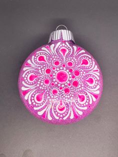 a pink ornament sitting on top of a table