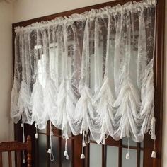 the curtains are hanging in front of the crib for protection from the wind and rain