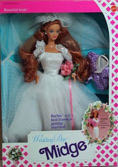 the barbie doll is in its box with her wedding dress and flower bouquet on it