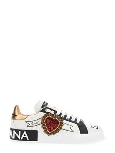 Women's Dolce & Gabbana Calfskin Portofino Sneakers With Embroidery - White These iconic Portofino sneakers come in calfskin nappa with scroll print and contrasting trims. The embroidered patch with branded heart adds embellishment to this feminine and versatile footwear: Calfskin nappa upper. Contrasting foiled Dauphine calfskin heel cup with rubber micro-injection logo. Flat laces. Calfskin footbed with branded label. Rubber sole with leather spoiler and micro-injection logo. Branded rubber so Dolce Gabbana Sneakers, Stefano Gabbana, White Leather Sneakers, Dolce E Gabbana, Dolce & Gabbana, White Sneakers, Sneakers White, Embroidered Patches, Leather Sneakers