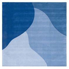 a blue rug with an abstract design on it