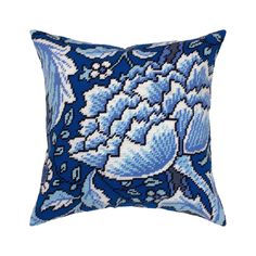 a blue and white pillow with flowers on it