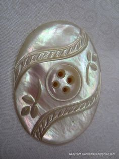 an image of a button that looks like it is made out of mother of pearl