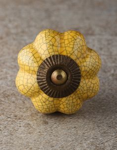 a yellow and brown object sitting on top of a table