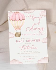 a pink and gold hot air balloon baby shower