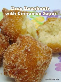 some sugared doughnuts on a plate with the words drop doughnuts with cinnamon sugar