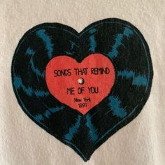 a heart shaped patch with the words songs that remind me of you