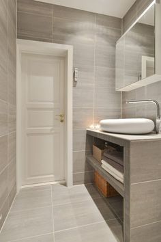 a bathroom with a sink and mirror in it