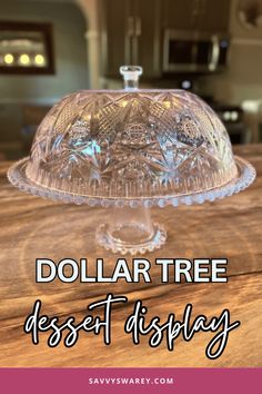 a glass cake plate with the words dollar tree dessert display above it on a wooden table