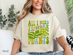 plant lover gift, crazy plant lady, just one more, plant mom shirt, plant lady, plant shirt, botanical shirt, plant lover, plant lover shirt, gift for her, gardening shirt, plant mama, plant tshirt, garden, garden shirt, i love plants, plant lady shirt, gift for plant lover, plant lady tee, plant lover t shirt, plant lady tshirt, plants shirt, farmer shirt, farmer, gardening, gardener, garderner gift, plant gift, gardening shirts, plant lovers gift, addicted to plants, botanical tee, aesthetic plant tee, Indulge your love for all things green with our enchanting "Plant Queen" shirt, a must-have for any botanical enthusiast. This stylish tee is beautifully designed for the proud plant mom or crazy plant lady in your life, making it the perfect gift for her special gardening moments. Crafted Spring Green Tops With Plant Details, Aesthetic Plant, Garden Shirt, Queen Shirt, Farmer Shirt, Plant Gift